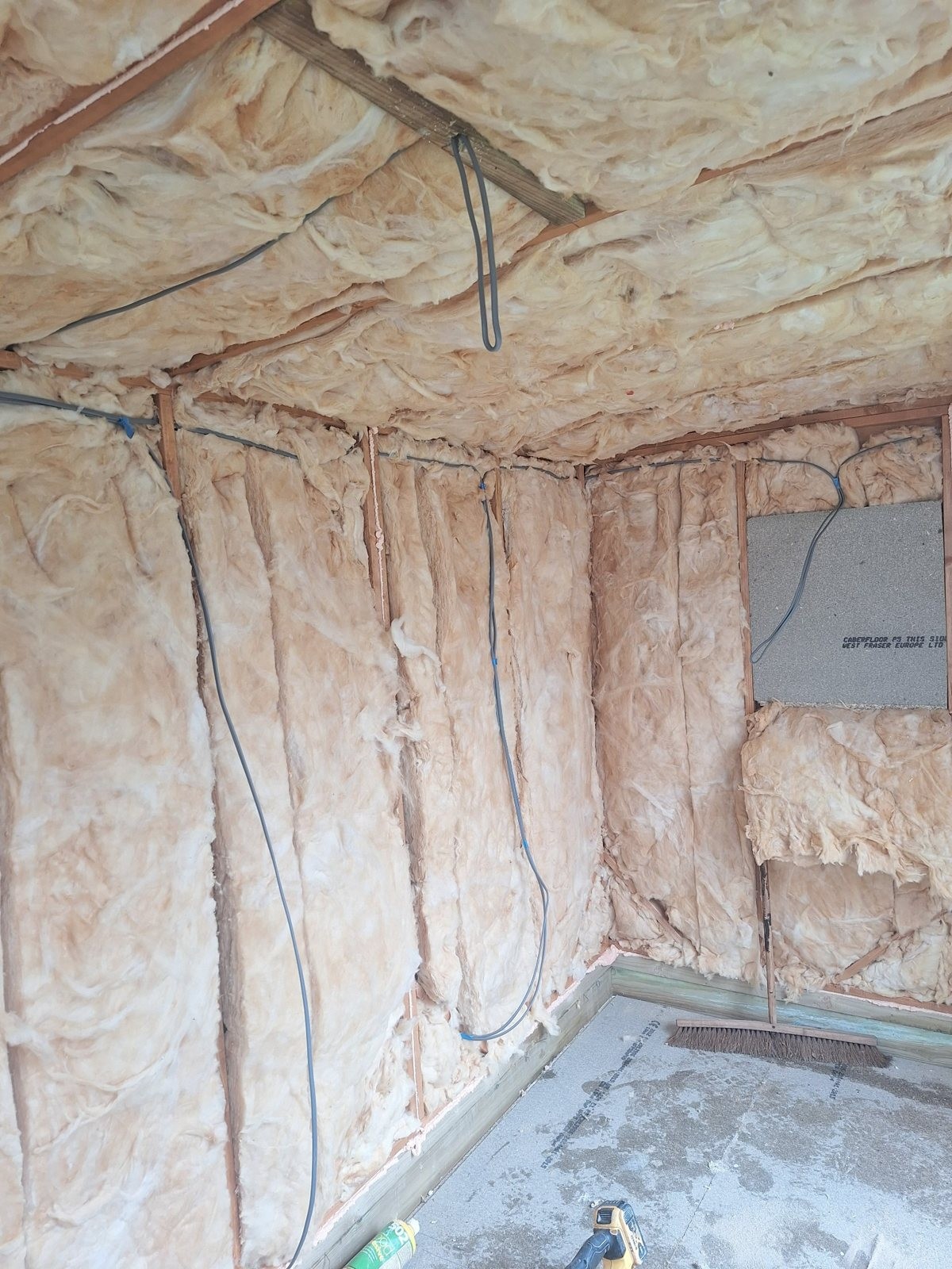 Summerhouse assembly and fit-out — Insulation and wiring